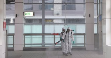 Soldiers in protective suits disinfect a metro station following a surge of COVID-19 infections in Taipei, Taiwan, May 19, 2021. (Reuters Photo)
