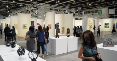Visitors look at artworks displayed at Art Basel in Hong Kong, China, May 19, 2021. (Reuters Photo)
