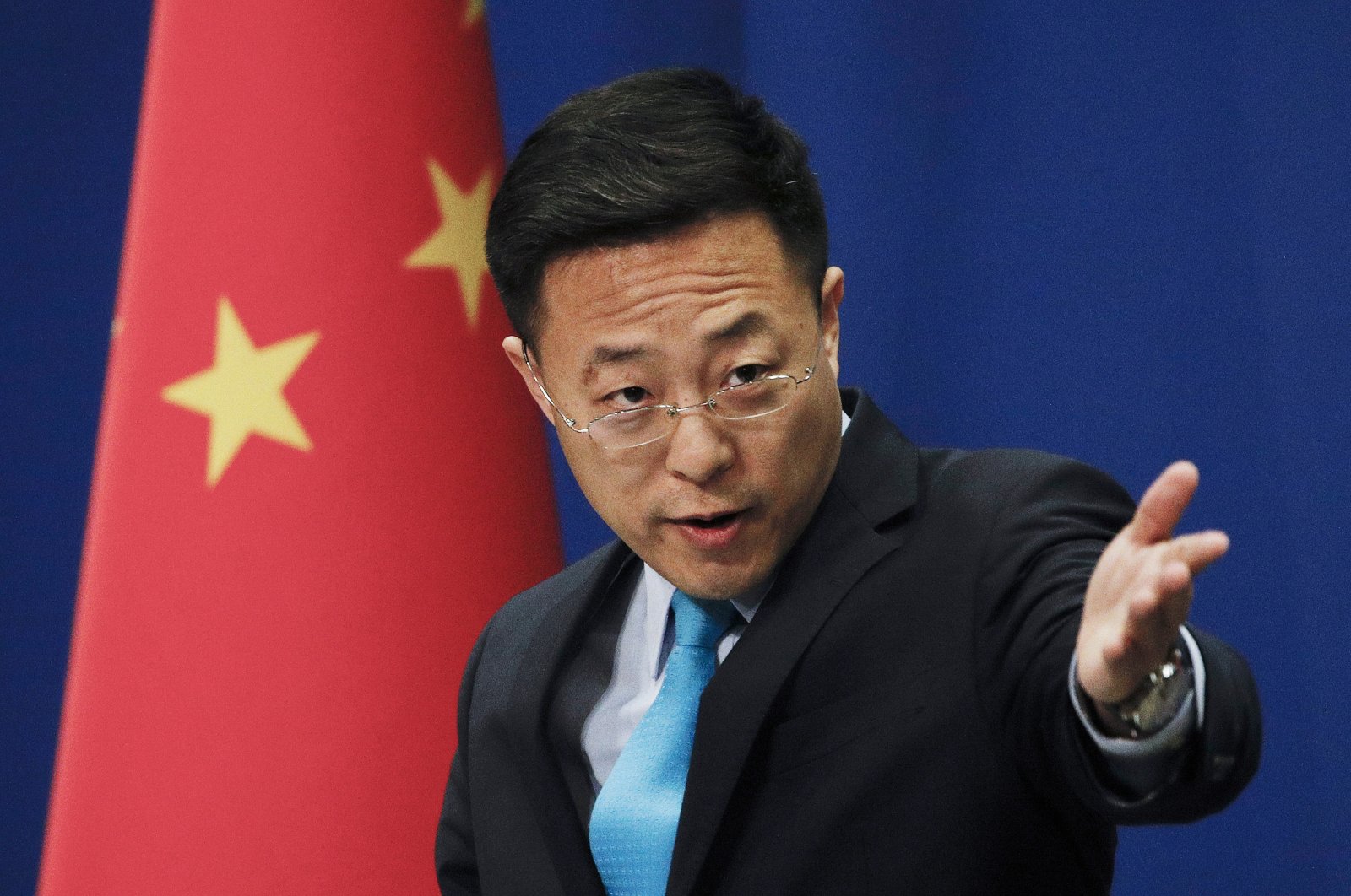 Chinese Foreign Ministry spokesperson Zhao Lijian gestures as he speaks during a daily briefing at the Chinese Ministry of Foreign Affairs office in Beijing, China, Feb. 24, 2020. (AP Photo File Photo)