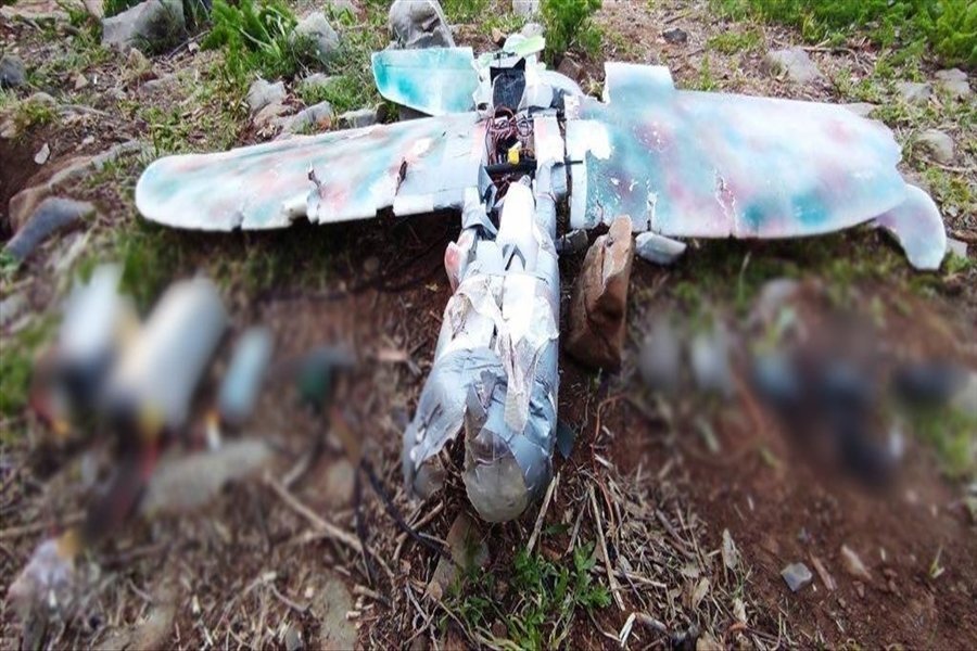 The wreckage of a PKK drone the terrorist group tried to use to mount an attack lies on the ground after Turkish security forces downed it in northern Iraq, May 11, 2021. (AA Photo)