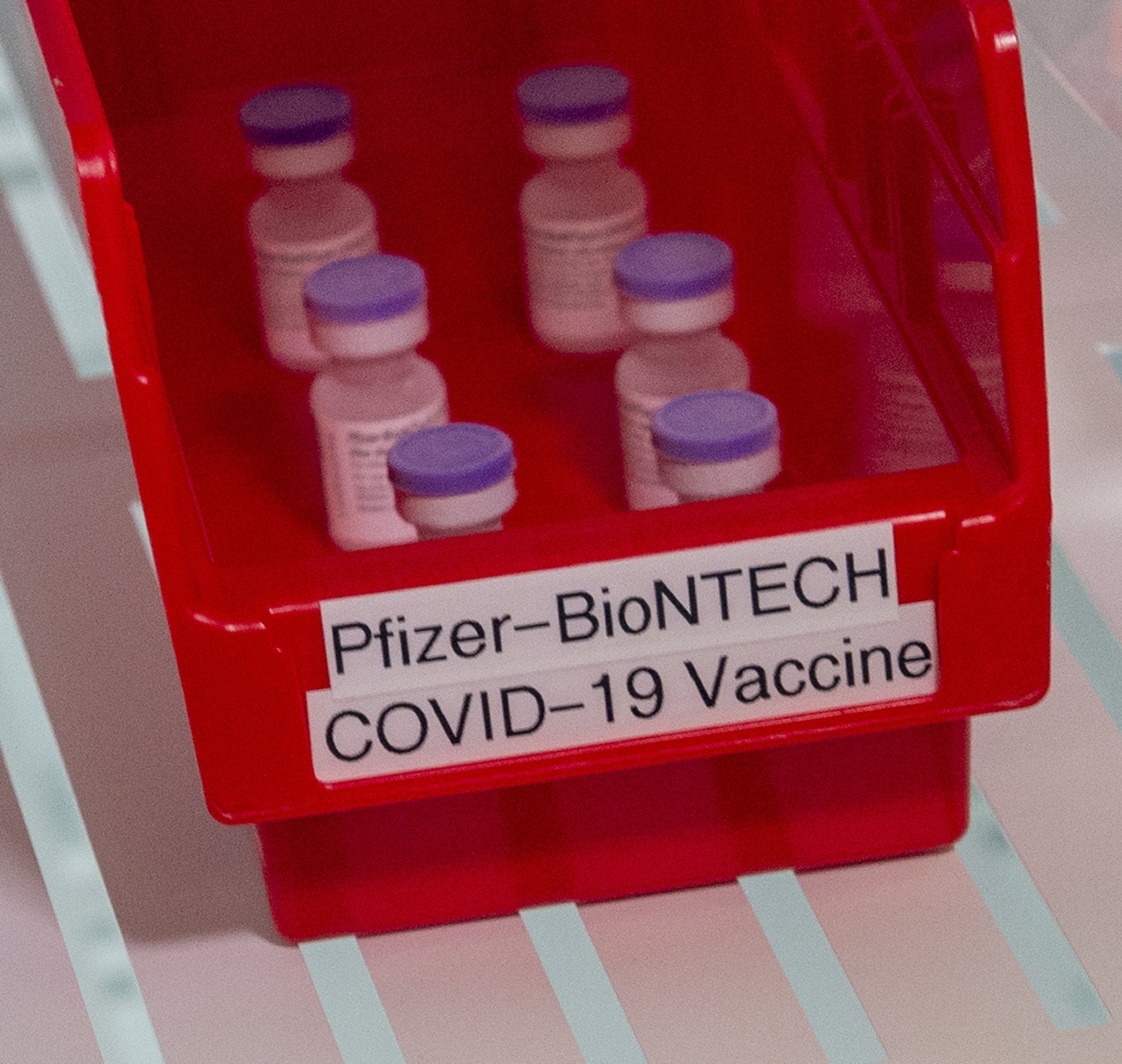 The first vials of Pfizer-BioNTech COVID-19 vaccine sit in a refrigerator at Ochsner Hospital on O'Neal Lane, in Baton Rouge, La., U.S., Dec. 15, 2020. (The Advocate via AP, Pool)