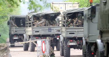Soldiers in military trucks are deployed in the area where heavily armed and far-right linked Jurgen Conings is believed to be located, in the Limburg province, Belgium, May 20, 2021. (AA Photo)