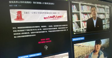 A webpage with the title "Pompeo stop your slanders! Only we Xinjiang people have a say!" and videos of ethnic Uyghurs responding to former U.S. Secretary of State Mike Pompeo are displayed on a computer screen in Beijing, China, May 19, 2021. (AP Photo)