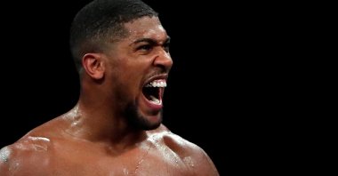 British boxer Anthony Joshua celebrates winning his fight against Kubrat Pulev, London, England, Dec. 12, 2020.