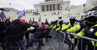 Trump supporters try to break through a police barrier at the Capitol in Washington, U.S., Jan. 6, 2021. With riot cases flooding into Washington’s federal court, the Justice Department is under pressure to quickly resolve the least serious cases. (AP Photo)