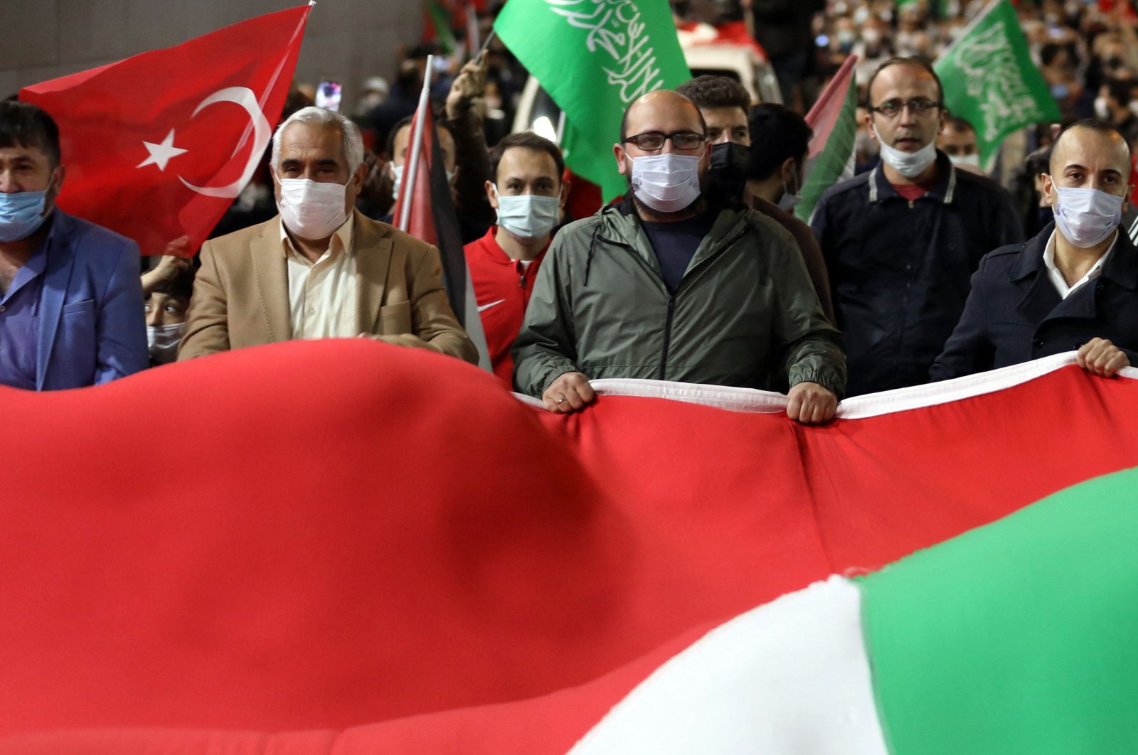 People demonstrate outside the Israel Consulate in Istanbul, late on May 10, 2021, against Israel's deadly air strikes launched on the Gaza Strip, Palestine, killing at least 20 people. (AFP Photo)