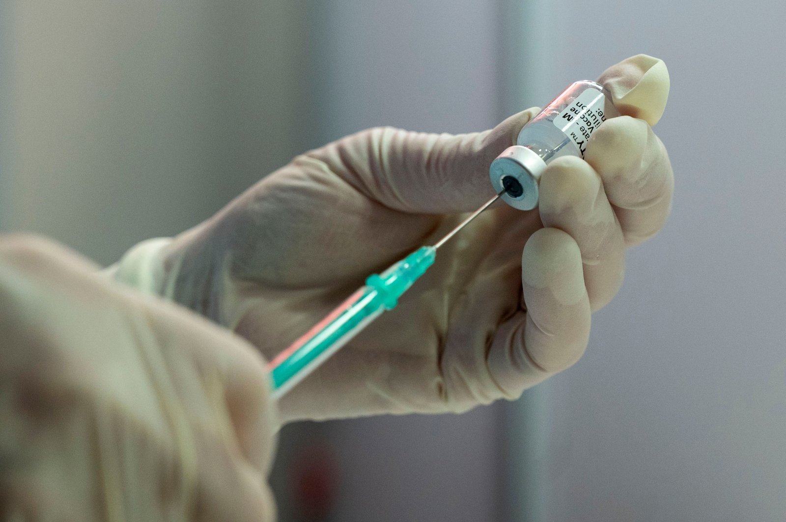 A nurse fills a syringe with the Pfizer Biontech vaccine at the vaccination center of German speciality chemicals company Evonik in Hanau, western Germany, on Mai 19, 2021, amid the ongoing coronavirus pandemic. (AFP Photo)