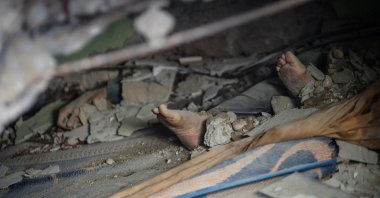 The bodies of victims killed by deadly Israeli bombardments are seen amid rubble in Gaza City, Palestine, May 16, 2021. (Reuters Photo)