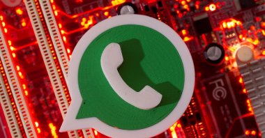 A 3D printed WhatsApp logo is placed on a computer motherboard in this illustration taken Jan. 21, 2021. (Reuters Photo)