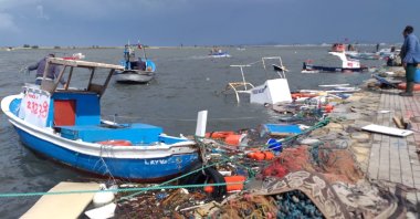 Sunken ships litter the coastline after being damaged by the recent storms in the town of Ayvalık, Turkey, May 21, 2021. (DHA Photo)