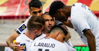 Lille's Burak Yılmaz (C) celebrates a goal with his teammates during a Ligue 1 match against Lens at the Stade Bollaert-Delelis in Lens, France, May 7, 2021. (IHA Photo)