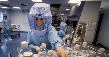 A laboratory worker simulates the workflow of vaccine production in a BioNTech cleanroom in Marburg, Germany, March 27, 2021. (AP File Photo)