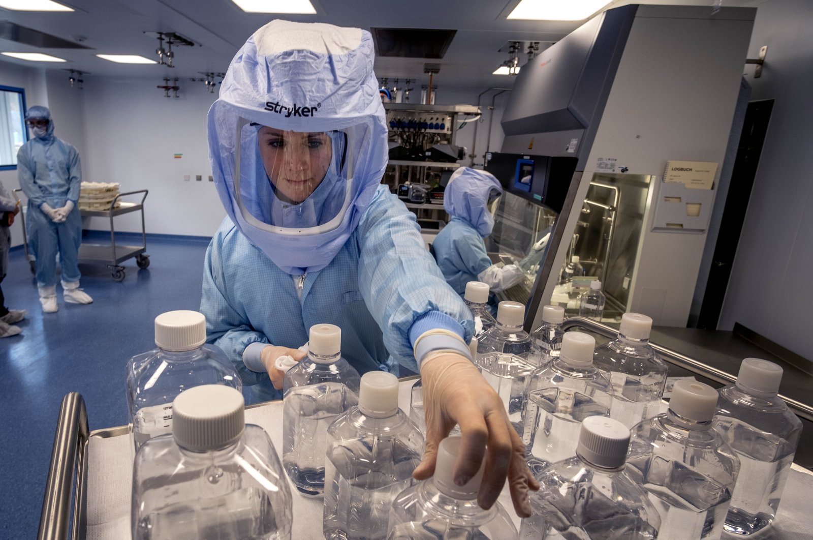 A laboratory worker simulates the workflow of vaccine production in a BioNTech cleanroom in Marburg, Germany, March 27, 2021. (AP File Photo)