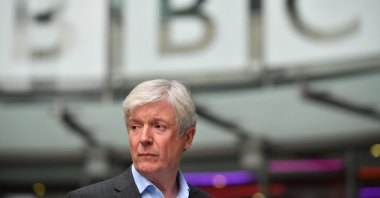 Director-General of the BBC Tony Hall is seen waiting to greet Britain's Prince William, Duke of Cambridge, and Britain's Catherine, Duchess of Cambridge, as the royal couple visit BBC Broadcasting House in London, to view the work the broadcaster is doing as a member of The Duke's Taskforce on the Prevention of Cyberbullying, London, U.K., Nov.15, 2018. (AFP Photo)
