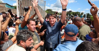 President Jair Bolsonaro greets a crowd during a non-scheduled visit to the city of Senador La Rocque, Maranhao state, Brazil, on May 21, 2021. (AFP Photo)