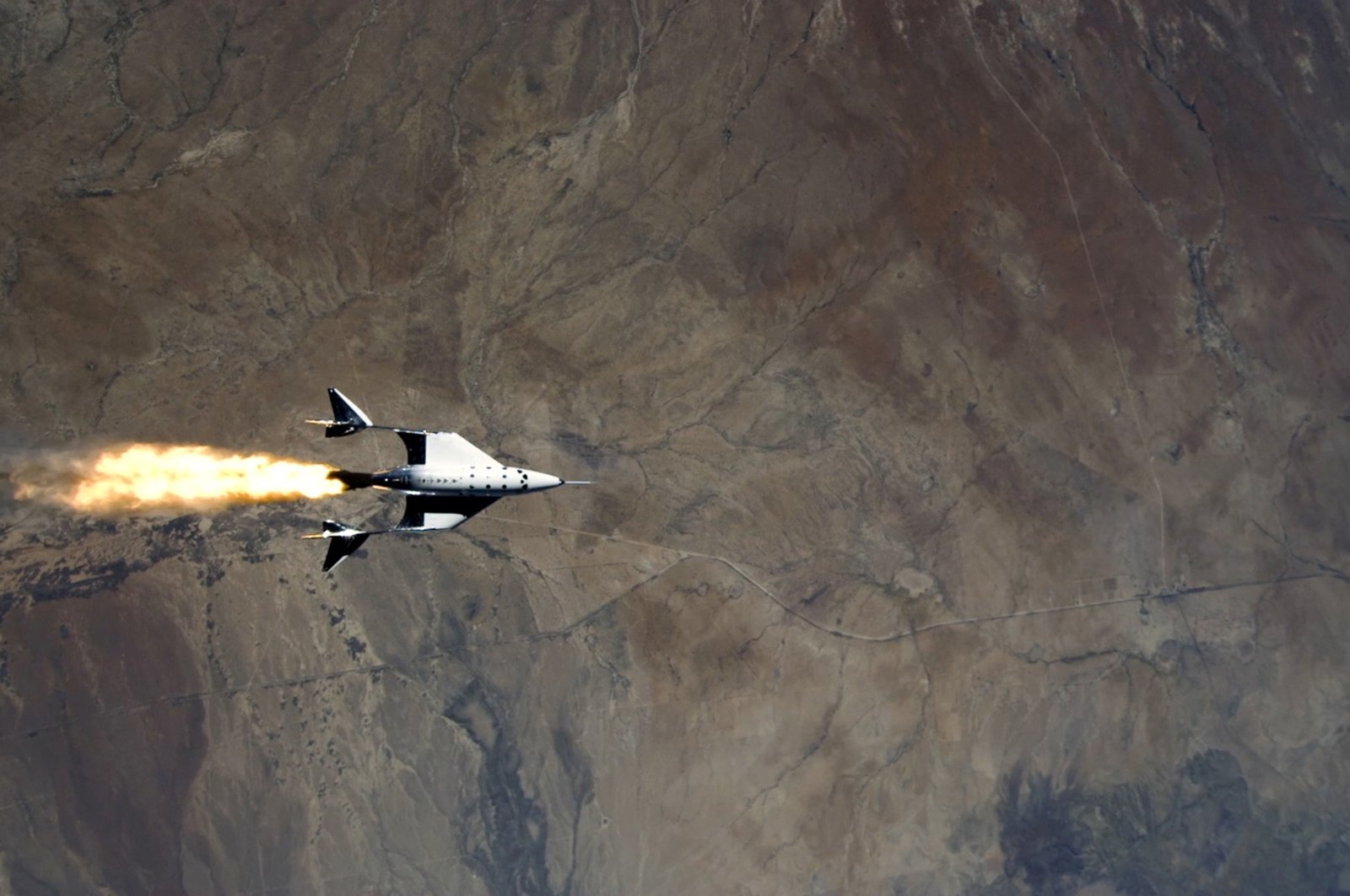 This still image from a video shows Virgin Galactic's VSS Unity starting its engines after release from its mothership as it commences its first spaceflight after launch from Spaceport America, New Mexico, U.S., May 22, 2021. (Reuters Photo)