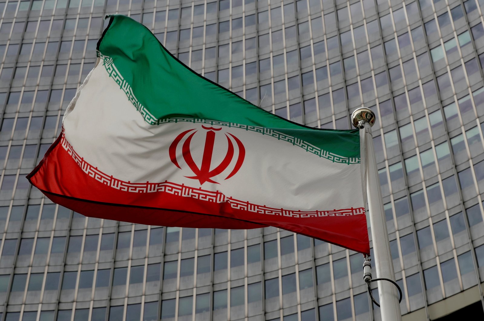 An Iranian flag flutters in front of the International Atomic Energy Agency (IAEA) headquarters in Vienna, Austria, Sept. 9, 2019. (Reuters Photo)