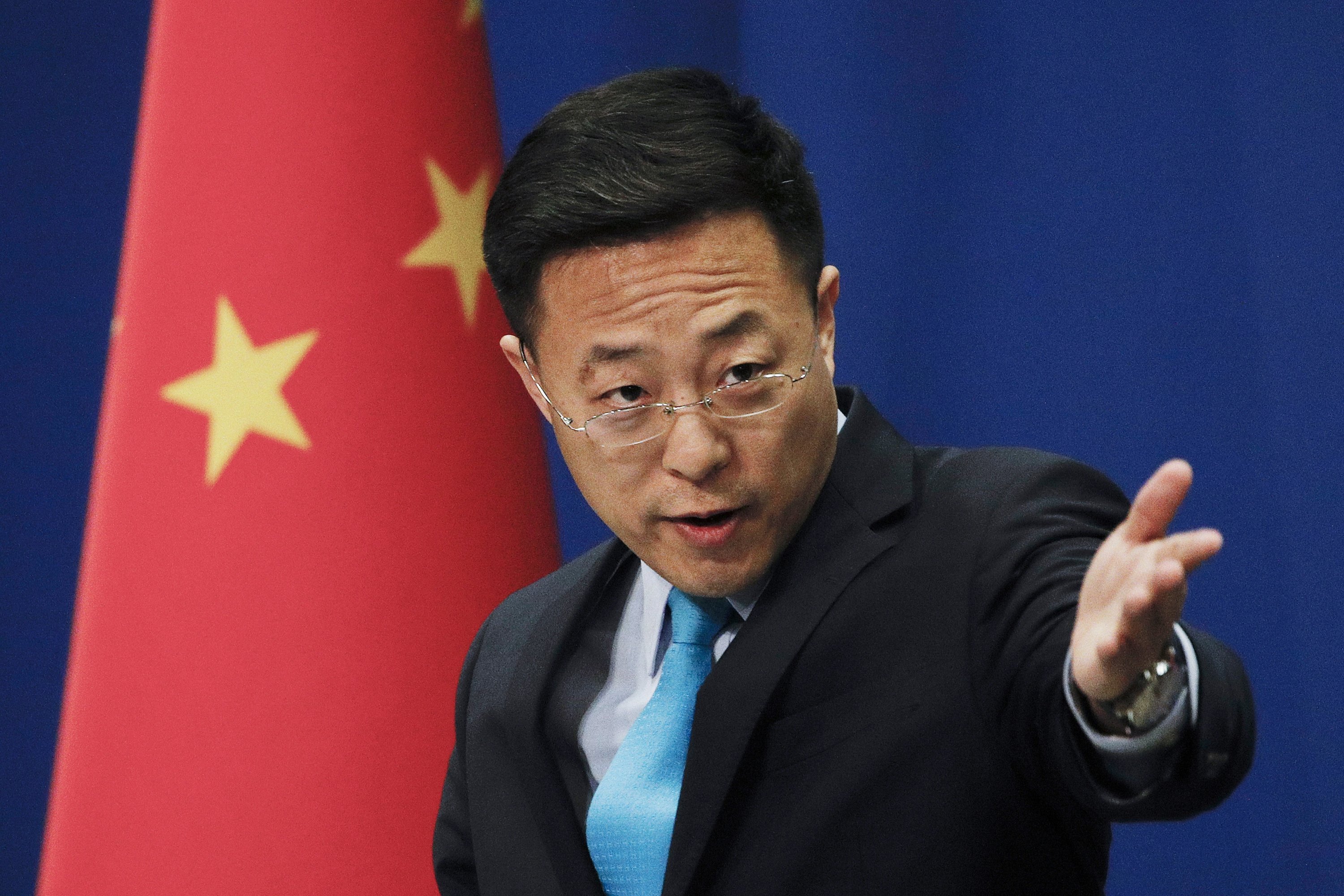 Chinese Foreign Ministry Spokesperson Zhao Lijian gestures as he speaks during a daily briefing at the Ministry of Foreign Affairs office in Beijing, China, Feb. 24, 2020. (AP Photo/File)