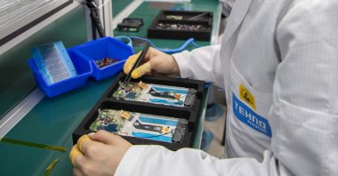 An employee works on a smartphone at Tecno Mobile factory in Istanbul, Turkey, May 24, 2021. (Courtesy of Tecno Mobile )