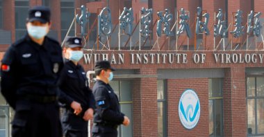 Security personnel keep watch outside the Wuhan Institute of Virology during the visit by the World Health Organization (WHO) team tasked with investigating the origins of the coronavirus disease (COVID-19), in Wuhan, Hubei province, China Feb. 3, 2021. (REUTERS/File Photo)