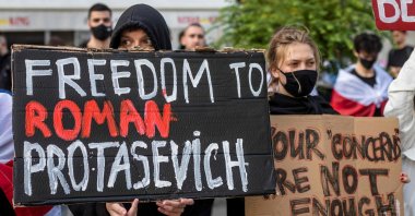 Belarusians living in Poland and Poles supporting them hold up a placard reading 'Freedom to Roman Protasevich' during a demonstration in front of the European Commission Office in Warsaw, Poland, May 24, 2021. (AFP Photo)