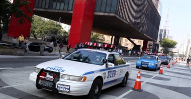 Brazilian fans of the New York Police Department (NYPD), whose hobby is to recreate the NYPD's cars and motorbikes, drive past Sao Paulo Museum of Art (MASP) in Sao Paulo, Brazil, May 16, 2021. (Reuters Photo)