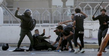 Members of security forces clash with demonstrators during an anti-government protest in Baghdad, Iraq, May 25, 2021. (Reuters Photo)