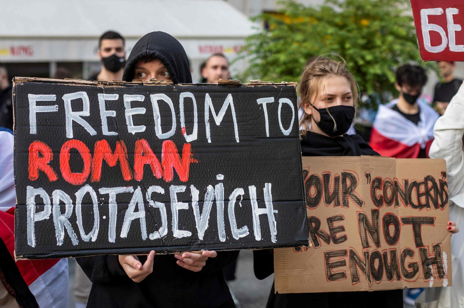 Belarusians living in Poland and Poles supporting them hold up a placard reading 'Freedom to Roman Protasevich' during a demonstration in front of the European Commission Office in Warsaw, Poland, May 24, 2021. (AFP Photo)