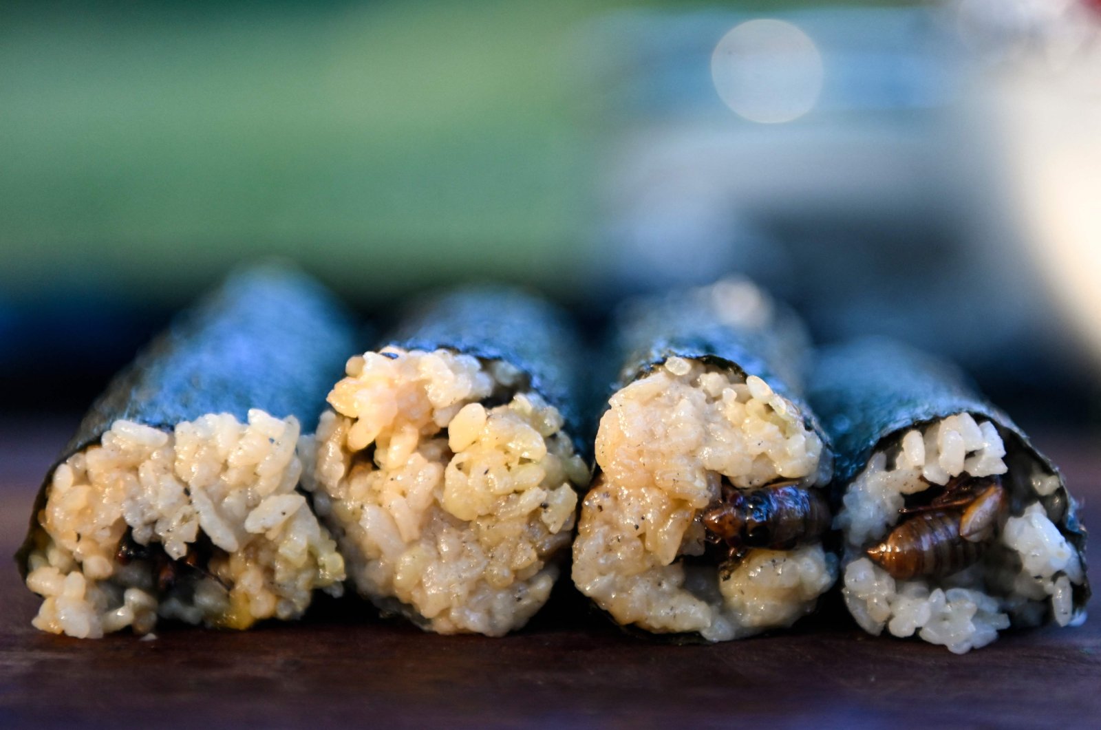Fried cicadas are rolled into a sushi roll by Chef Bun Lai at Fort Totten Park in Washington D.C., U.S., May 23, 2021. (AFP Photo)