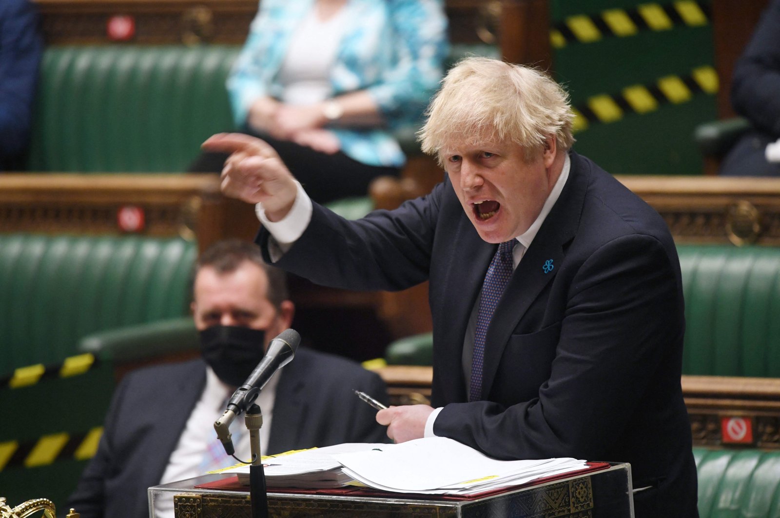 A handout photograph released by the U.K. Parliament shows Britain's Prime Minister Boris Johnson attending Prime Minister's Questions (PMQs) in a socially distanced, hybrid session at the House of Commons, in central London, U.K., May 19, 2021. (Jessica Taylor /UK Parliament via AFP)