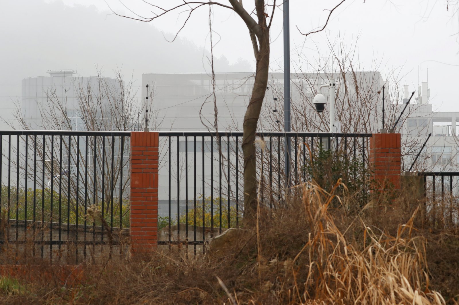 The P4 laboratory of Wuhan Institute of Virology is seen behind a fence during the visit by the World Health Organization (WHO) team tasked with investigating the origins of coronavirus in Wuhan, Hubei province, China Feb. 3, 2021. (Reuters Photo)
