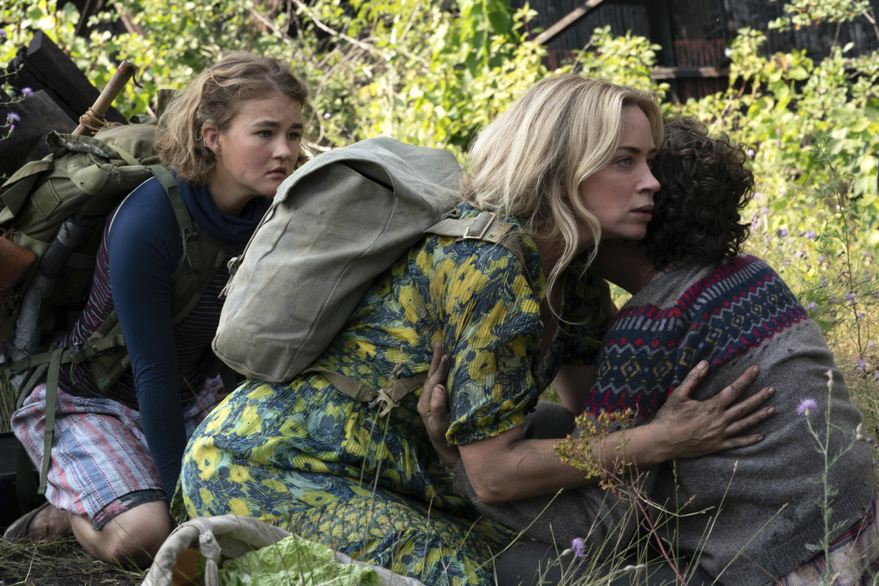 Emily Blunt (C) hugs her on-screen son Noah Jupe (R) as Millicent Simmonds watches on, in a scene from 'A Quiet Place Part II.' (Paramount Pictures via AP)