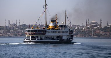 An iconic ferry cruises along with the historical Blue Mosque (L) and Hagia Sophia Grand Mosque (R) visible in the background, Istanbul, Turkey, May 13, 2021. (Photo by Getty Images)