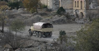 Azerbaijani soldiers patrol streets after sunset in Aghdam, Azerbaijan, Nov. 25, 2020. (AP Photo)