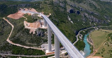 An aerial view shows a part of the new highway connecting the city of Bar on Montenegro's Adriatic coast to landlocked neighbor Serbia, which is being constructed by China Road and Bridge Corporation (CRBC), the large state-owned Chinese company, near Matesevo, Montenegro, May 11, 2021. (AFP Photo)