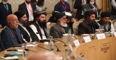 Former President Hamid Karzai (L) and Taliban co-founder Mullah Abdul Ghani Baradar, (2nd R), attend an international peace conference in Moscow, Russia, March 18, 2021. (AP File Photo)