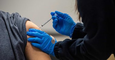 A man gets inoculated with the Pfizer-BioNTech COVID-19 vaccine at La Colaborativa in Chelsea, Massachusetts, U.S., Feb. 16, 2021. (AFP Photo)