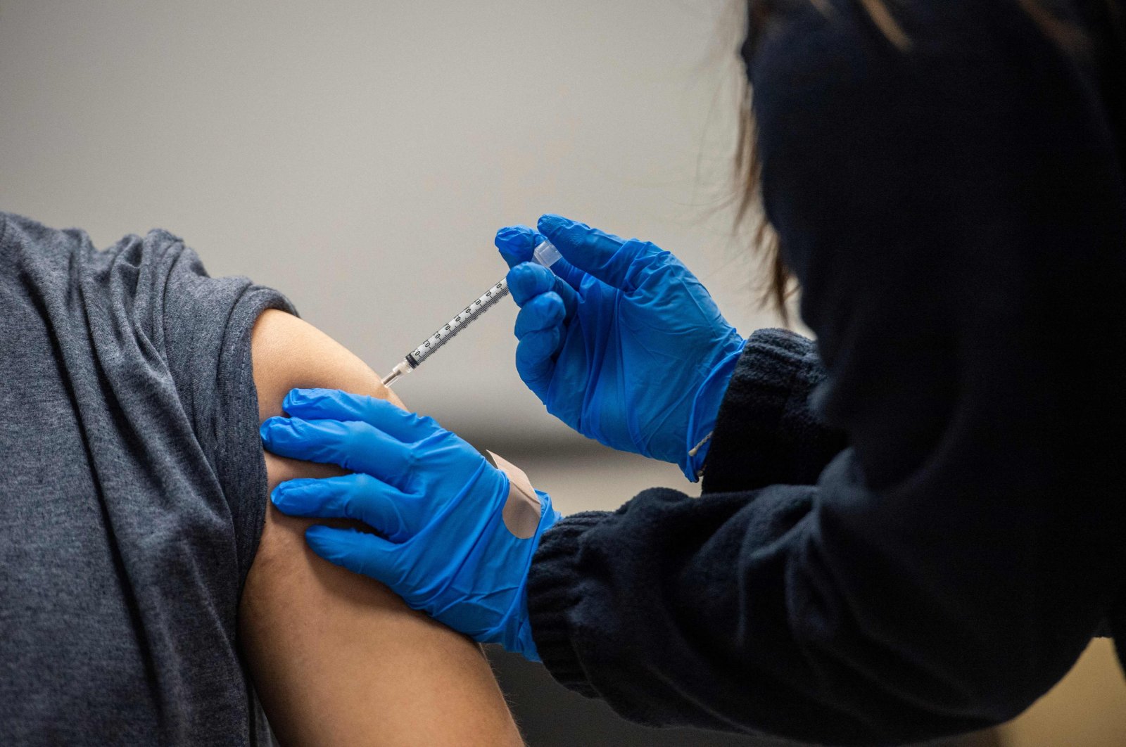 A man gets inoculated with the Pfizer-BioNTech COVID-19 vaccine at La Colaborativa in Chelsea, Massachusetts, U.S., Feb. 16, 2021. (AFP Photo)