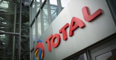 This file photo shows the logo of French oil company headquarters Total in La Defense business district on the outskirts of Paris, France, Oct. 21, 2014.  (AFP Photo)