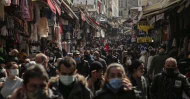 People walk in an open market in Istanbul, Turkey, March 22, 2021. (AP Photo)