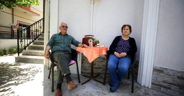 Cemil, 73, and Kıymet Birtane, 70, sit in their garden in Kırklareli province bordering Bulgaria, Edirne, Turkey, May 28, 2021. (Özgün Tiran / Anadolu Agency)