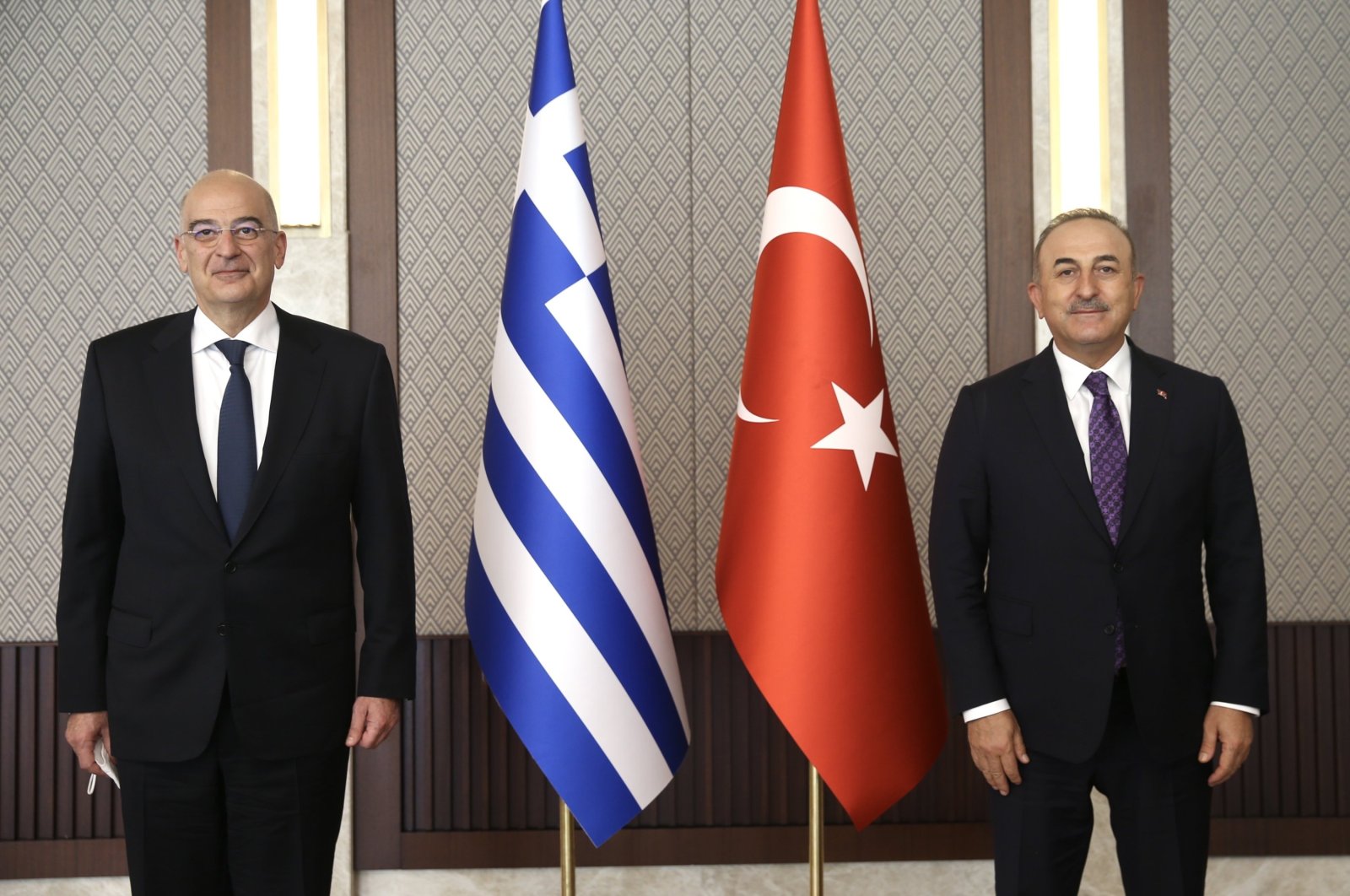 Greek Foreign Minister Nikos Dendias (L) and Turkish Foreign Minister Mevlüt Çavuşoğlu pose for a photo prior to their meeting in Ankara, Turkey, April 15, 2021. (Photo made available by the Turkish Foreign Ministry's press office/EPA Photo)