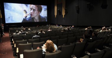 Moviegoers sit in a socially distant seating arrangement at the AMC Lincoln Square 13 theater on the first day of reopened theaters in New York City, New York, U.S., March 5, 2021. (Photo by Evan Agostini/Invision/AP, File)