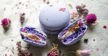 A macaron or French macaroon is a sweet meringue-based confection made with egg white, icing sugar, granulated sugar, almond meal and food coloring. (Shutterstock Photo)
