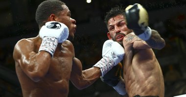Devin Haney (L) punches Jorge Linares during the WBC lightweight title boxing match Saturday, May 29, 2021, in Las Vegas, U.S. (AP Photo)
