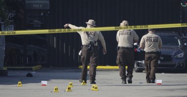 Miami-Dade police work the scene of a shooting outside a banquet hall near Hialeah, Florida, May 30, 2021. (AP Photo)