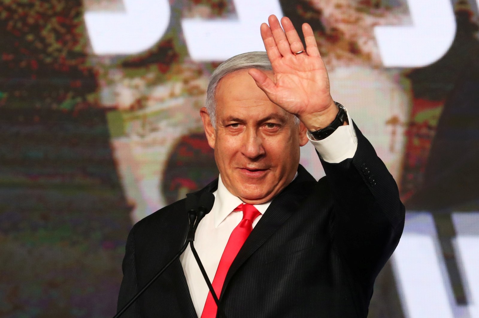Israeli Prime Minister Benjamin Netanyahu gestures as he delivers a speech to supporters following the announcement of exit polls in Israel's general election at his Likud party headquarters in Jerusalem, Israel, March 24, 2021. (Reuters Photo)