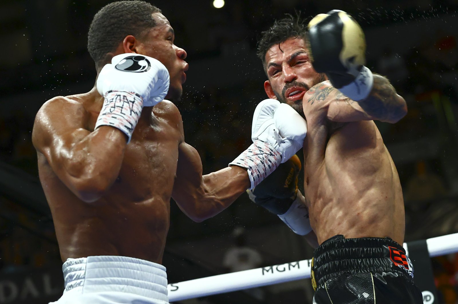 Devin Haney (L) punches Jorge Linares during the WBC lightweight title boxing match Saturday, May 29, 2021, in Las Vegas, U.S. (AP Photo)