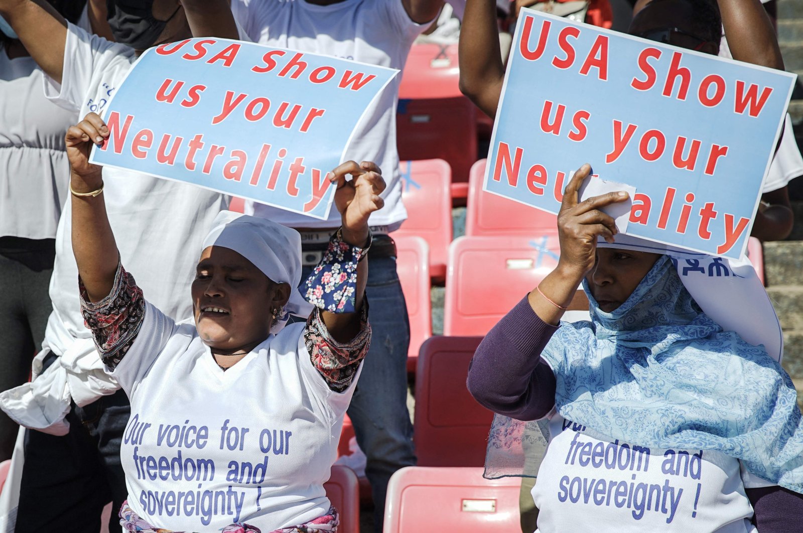 Protesters hold their messages during a massive rally to rail against the United States imposing restrictions on economic and security assistance over the conflict in the Tigray region at Addis Ababa soccer stadium, Addis Ababa, Ethiopia, May 30, 2021. (AFP Photo)
