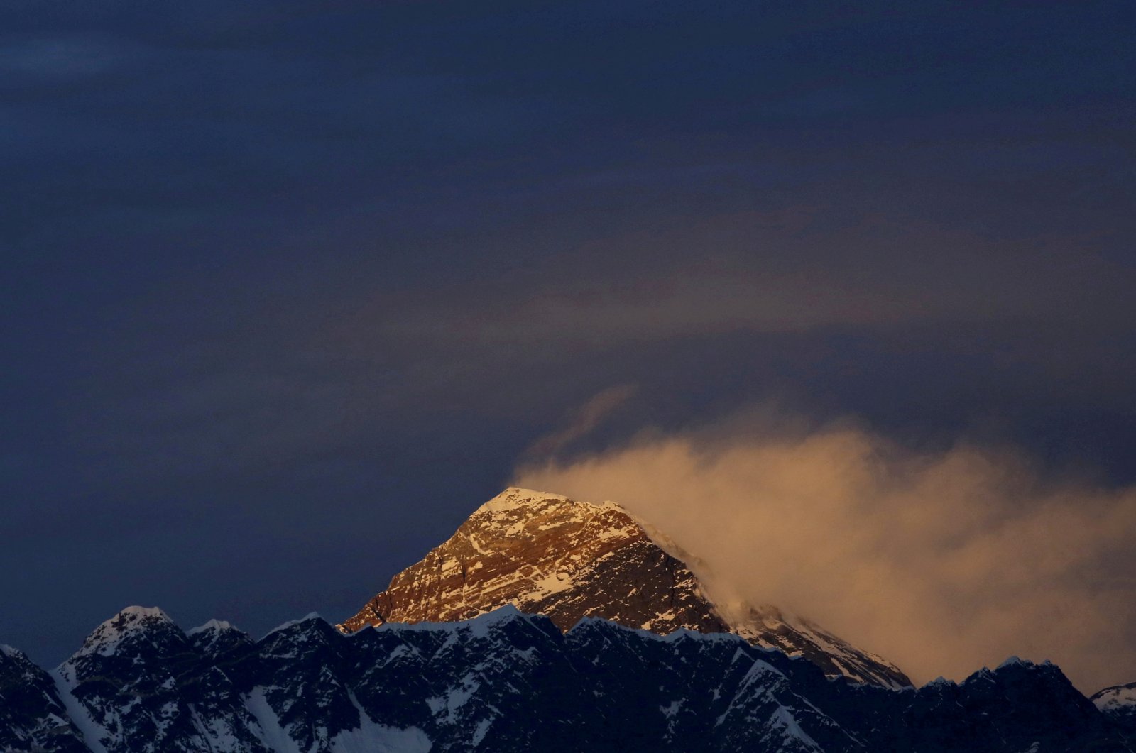 FILE PHOTO: Light illuminates Mount Everest, during sunset in Solukhumbu District also known as the Everest region, November 30, 2015. REUTERS/Navesh Chitrakar/File Photo
